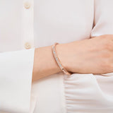 Set Stone Hinged Bangle in 18k Rose Gold Plating & Clear